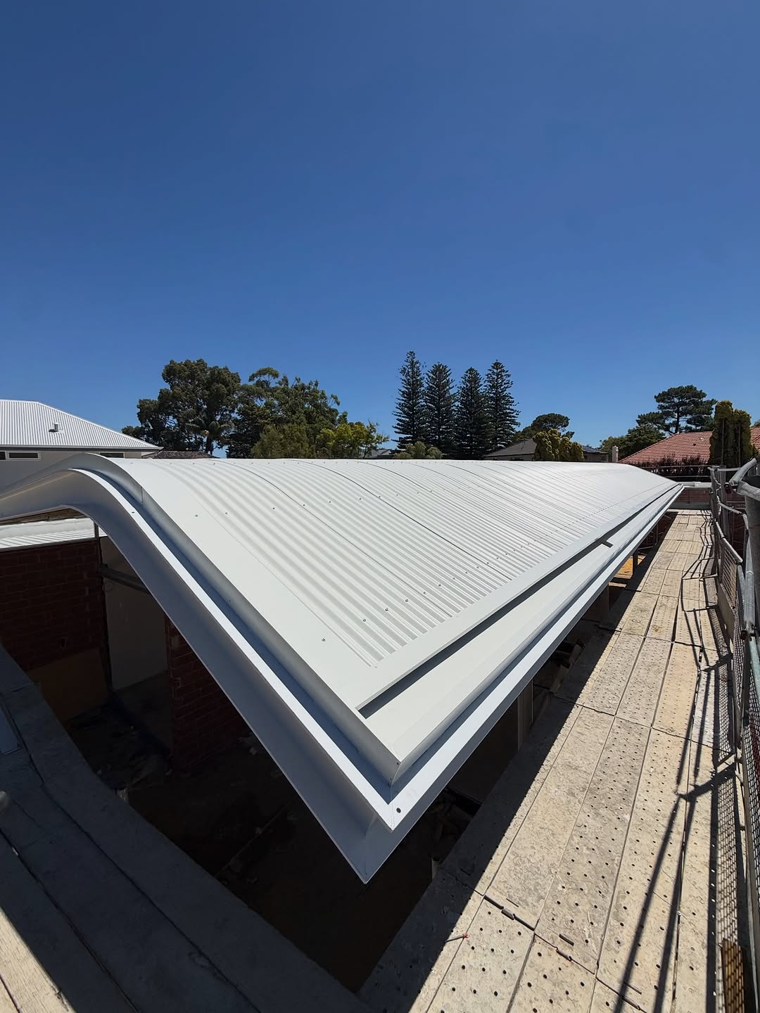 Curved Custom Orb feature roof with a large Trimdek roof behind on a Dalkeith home
