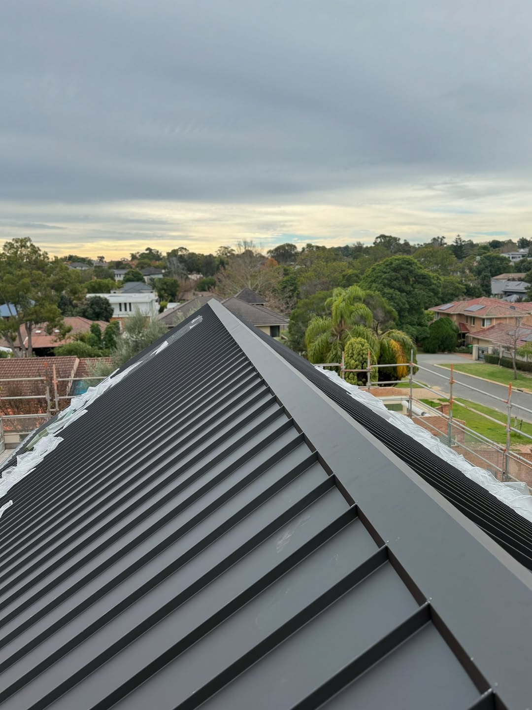 Progress shots of a standing-seam nailstrip cladding project in Dalkeith